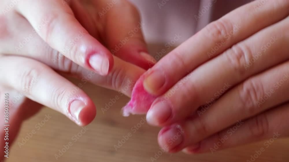 Close Up Female Hands Removing Nail Polish With Cotton Pad, Tilt Up. Close Up Female Hands Removing Nail Polish With Cotton Pad, Tilt Up.
