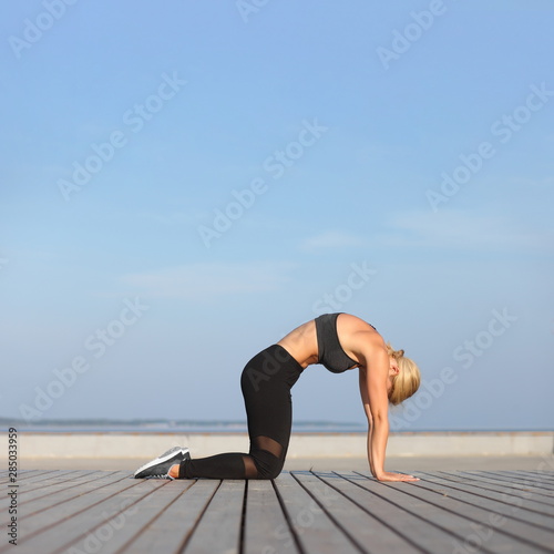 young woman practising yoga exercise