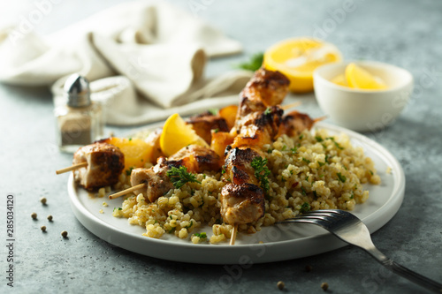 Homemade chicken skewers with bulgur and herbs photo