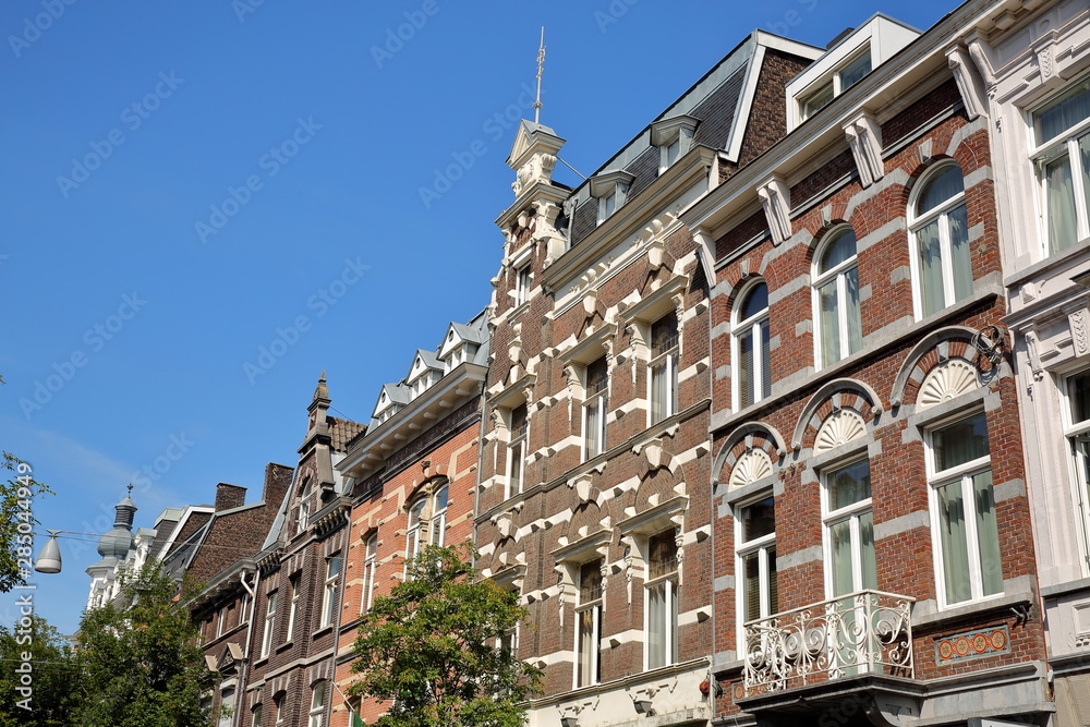 Historic buildings with carvings located in Wyck neighborhood (on Wycker Brugstraat street), Limbourg, Maastricht, Netherlands