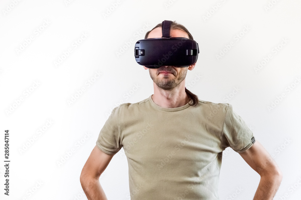 Man exploring modern technology virtual reality with head mounted display on white background Man exploring modern technology virtual reality with head mounted display on white background