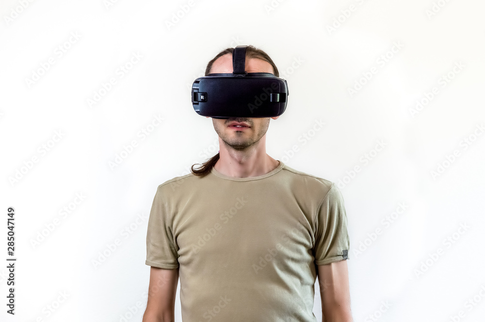 Man exploring modern technology virtual reality with head mounted display on white background Man exploring modern technology virtual reality with head mounted display on white background