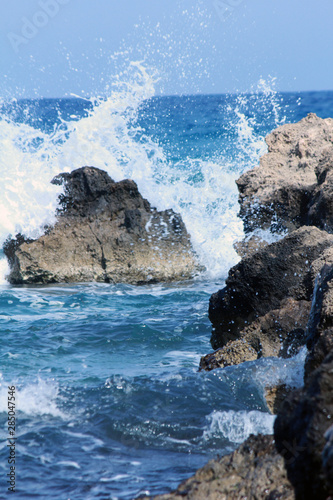 wavy sea and rocks and beach
