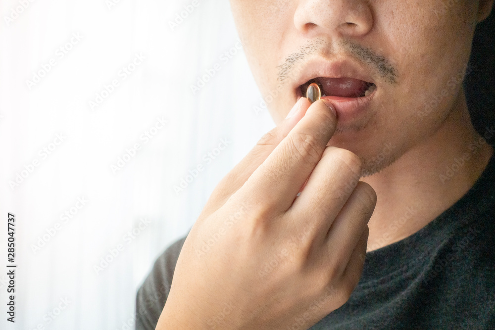 Close up hand is holding vitamins pills Close up hand is holding vitamins pills