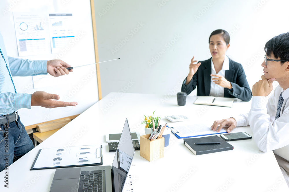 Young businessman stand in front of the group Young businessman stand in front of the group