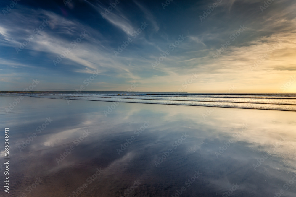 Reflections on the beach at low tide, Saunton Sands, on the north Devon coast.