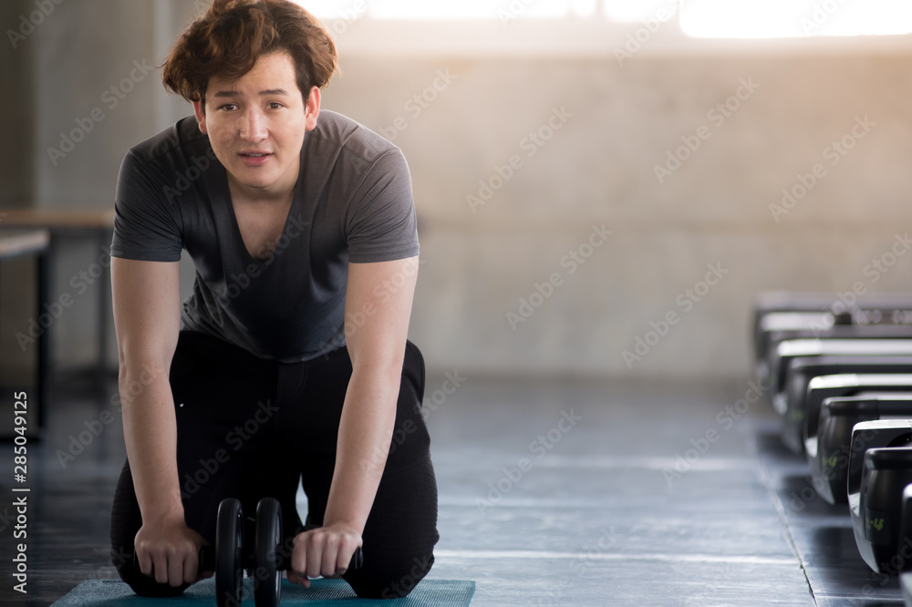 Attractive young man European and Thai nationalities Exercise in the gym Concept, exercise and exercise for health Attractive young man European and Thai nationalities Exercise in the gym Concept, exercise and exercise for health