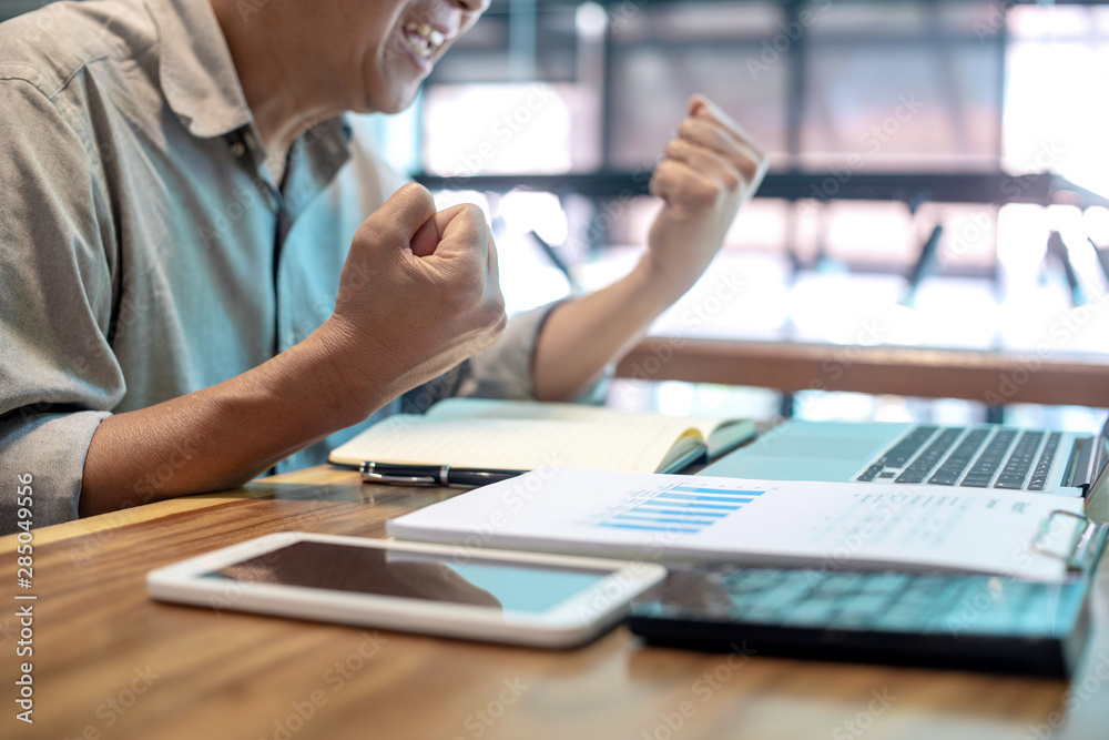 Businessman in casual style working with graph Businessman in casual style working with graph