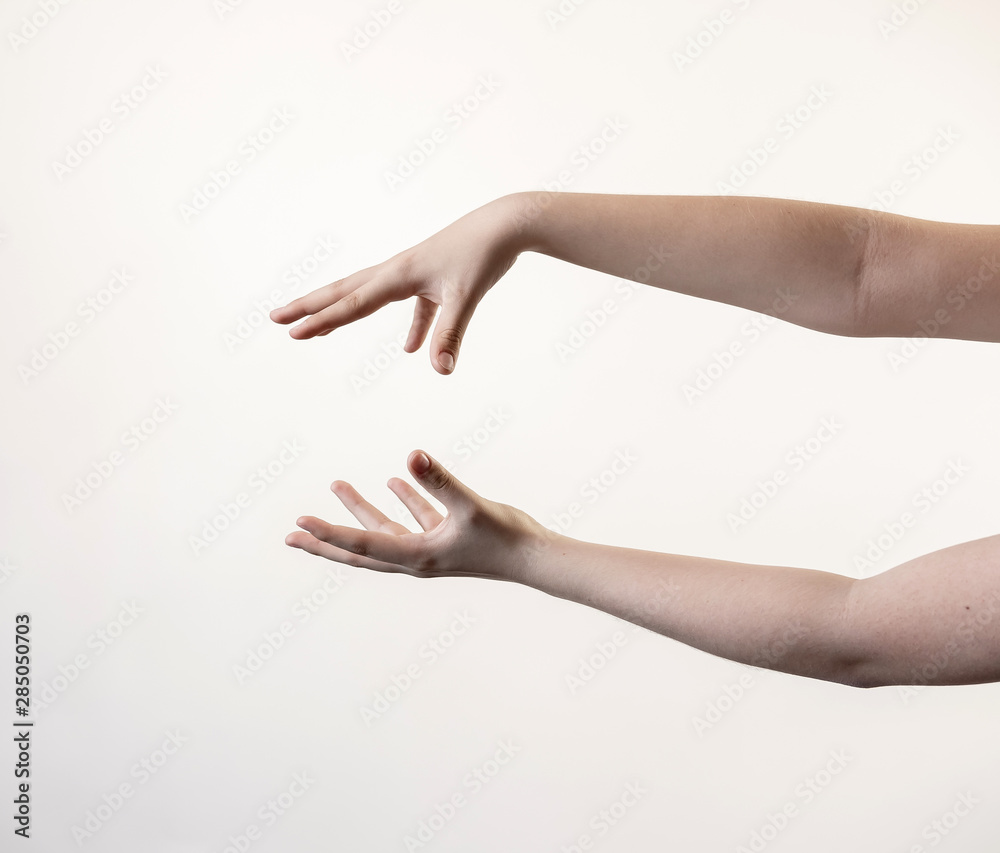 Hands and arms showing symbols holding pointing