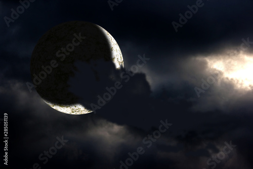 moon behind the dark cloud