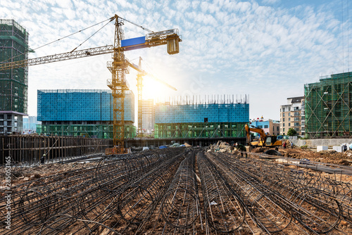 Construction sites, steel structures and cranes under the blue sky. 