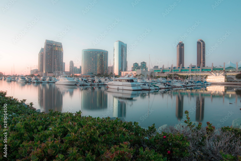 Fototapeta premium boats in a pier at san diego waterfront with the convention center