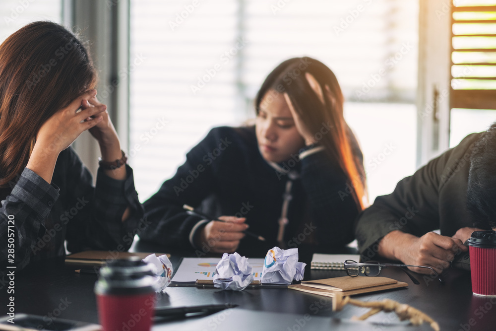 Businesspeople get stressed while having a problem in business meeting Businesspeople get stressed while having a problem in business meeting
