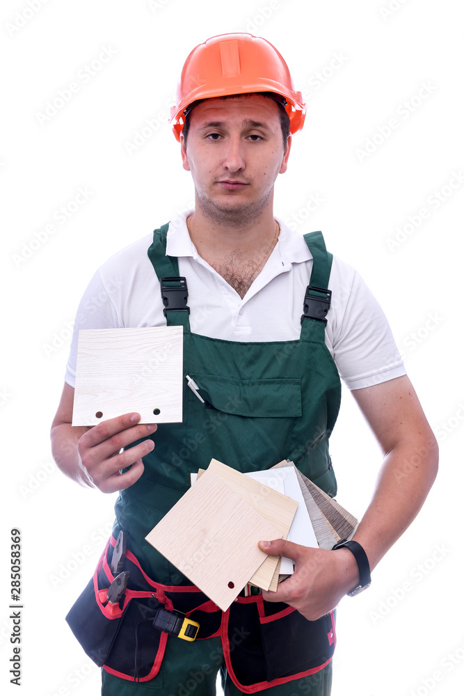 Worker pointing at wooden sampler isolated on white