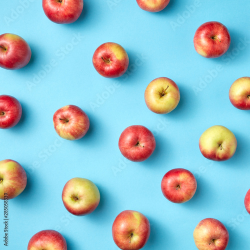 Fruit apples pattern on blue.