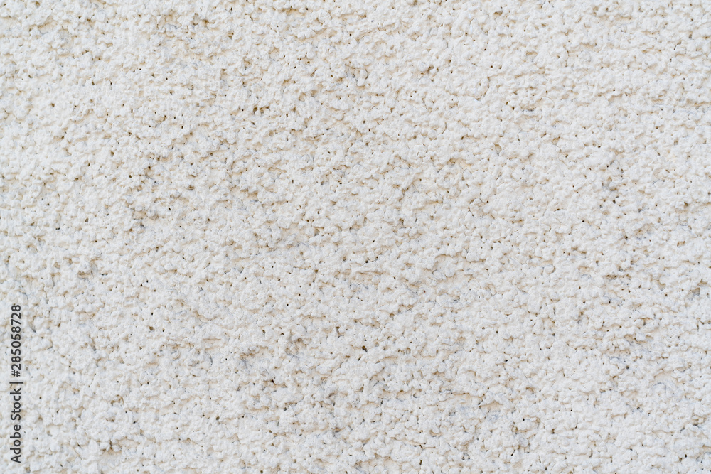 Gray texture of uneven plaster on the wall of the house. Gray texture of uneven plaster on the wall of the house.