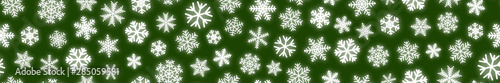 Christmas horizontal seamless banner of white snowflakes on green background