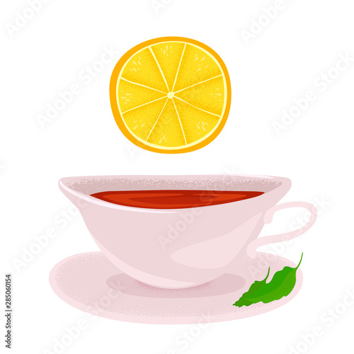 A piece of lemon above a cup of tea. Hot drink with mint leaves.
