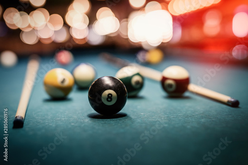 Colorful billiard balls on table close up photo
