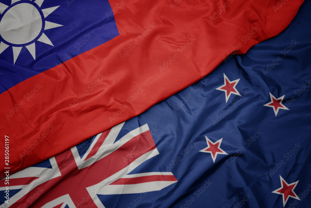 waving colorful flag of new zealand and national flag of taiwan. waving colorful flag of new zealand and national flag of taiwan.