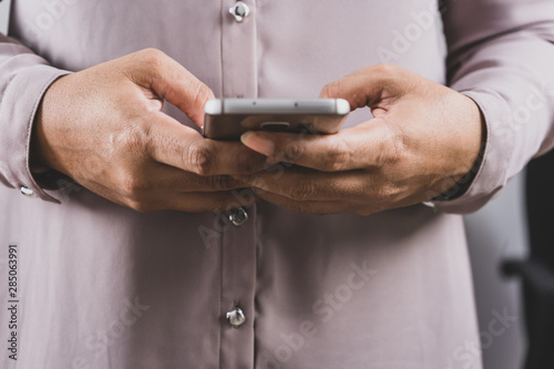 Close up of a woman using mobile smart phone