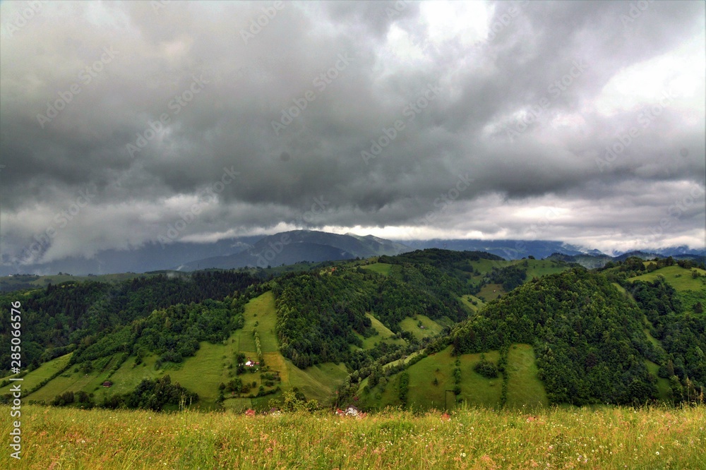 Naklejka premium storm clouds above the mountains