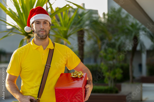 Brazilian mailman dressed as Santa Claus.
