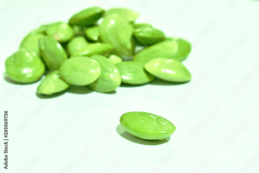 twisted cluster bean seed arranging on white background twisted cluster bean seed arranging on white background