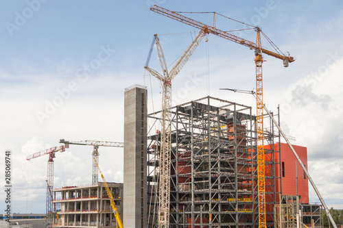 Cranes and building a modern factory building steel structure