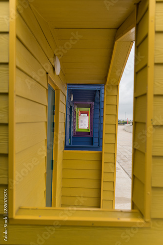 side view of beach hut looking through window pane