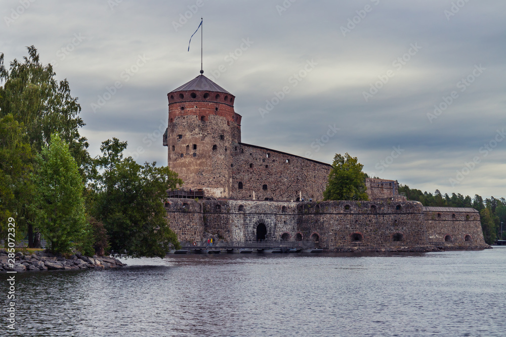 old Olavinlinna Olofsborg Castle in cloudy weather in Savonlinna, Finland