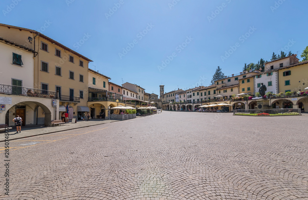 The beautiful Matteotti square in triangular shape in the historic center of Greve in Chianti, Florence, Tuscany, Italy
