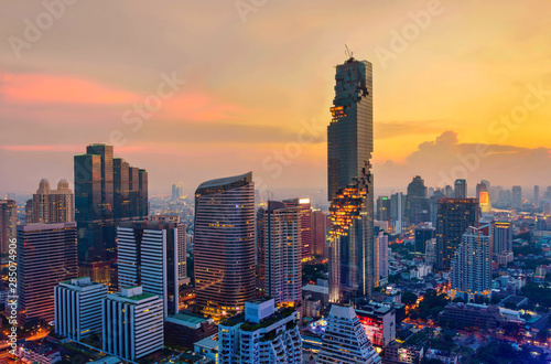 Aerial view of Bangkok modern office buildings, condominium in Bangkok city downtown with sunset sky photo