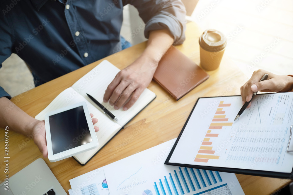 Business Administrator meeting with financial data in office room. Business Administrator meeting with financial data in office room.