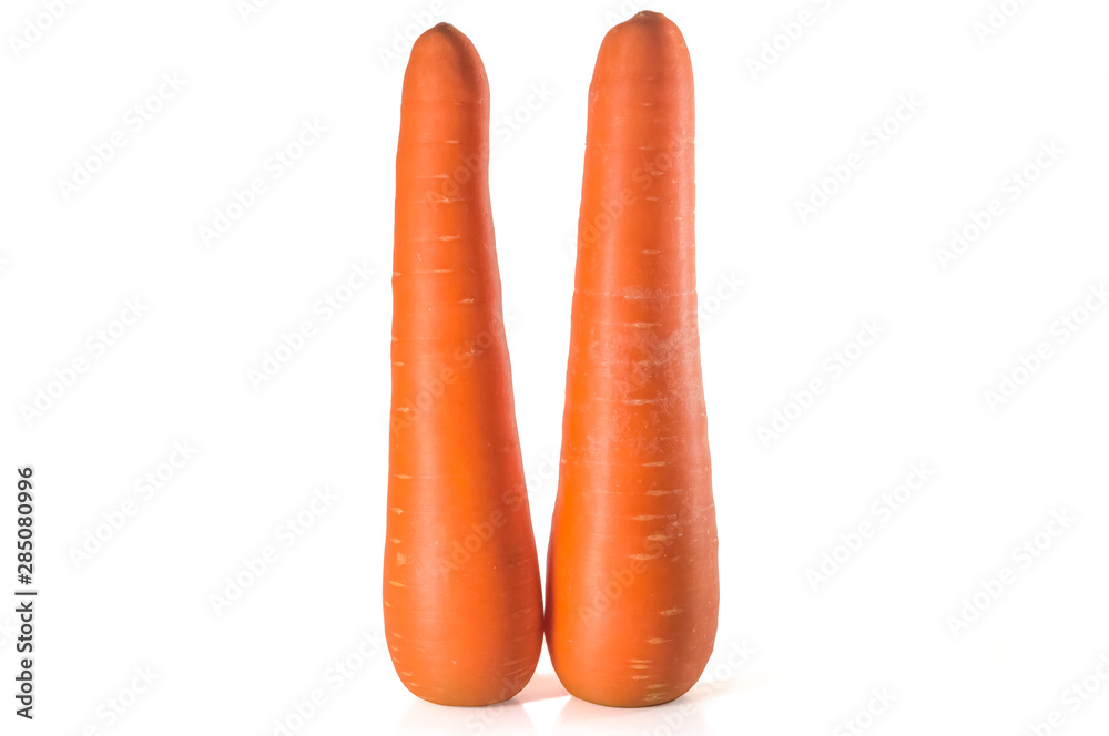 Two standing fresh orange carrots isolated on white background Two standing fresh orange carrots isolated on white background