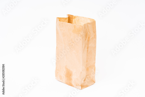 Crumpled brown paper bag on white background