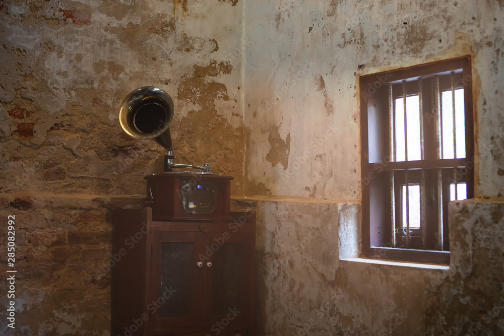 Vintage Gramaphone music box inside wall as retro background