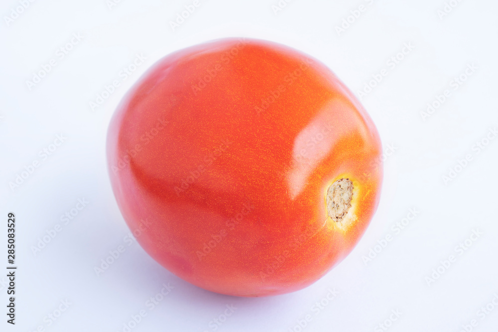 Fresh red tomato on the white background Fresh red tomato on the white background