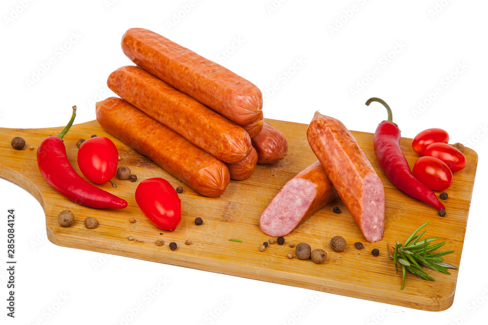 sausages with vegetables on a cutting board sausages with vegetables on a cutting board