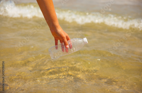 Close up plastic waste on beach after tide. Human impact on environment concept. Going Zero Waste. Pollution of the World Ocean by Plastic