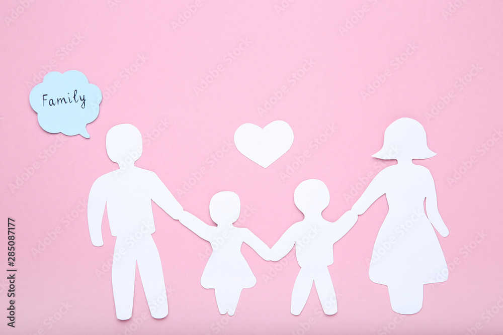 Paper family figures with heart and speech bubble on pink background Paper family figures with heart and speech bubble on pink background