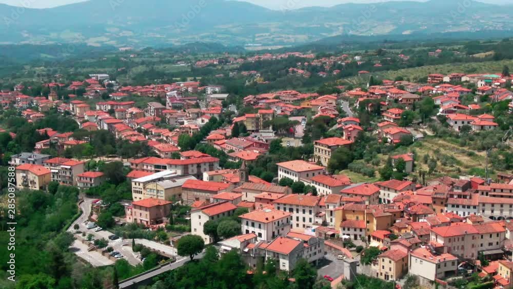 Stunning cityscape of Poggio alla Croce in sunny summer weather. Drone flying over beautiful city italian architecture in green landscape. Stunning cityscape of Poggio alla Croce in sunny summer weather. Drone flying over beautiful city italian architecture in green landscape.