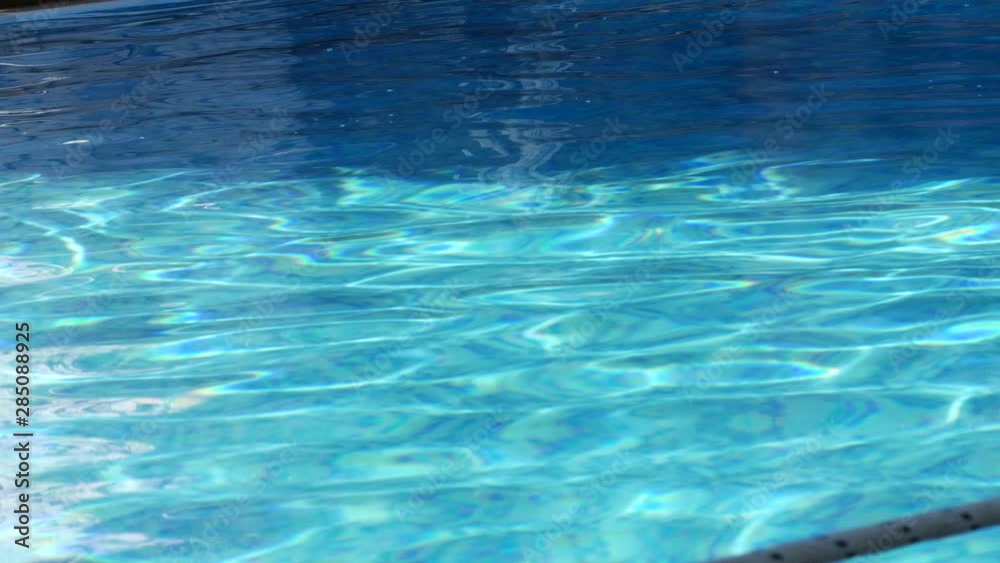 Blue Bottom of a Swimming Pool with Clear and Cool Water