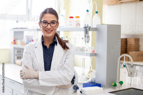 Woman in white uniform in laboratory work on analize