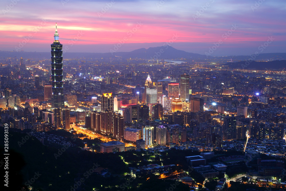 Panoramic aerial view of Downtown Taipei City at dusk, with landmark tower in Xinyi Commercial District ~A romantic evening in Taipei, capital city of Taiwan, with dramatic rosy afterglow in the sky
