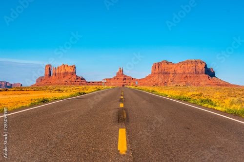 The road with its yellow lines of Monument Valley, Utah