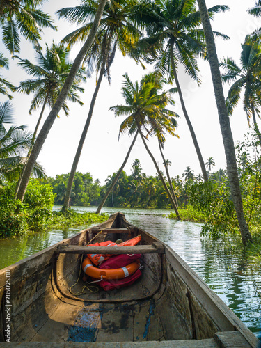 river cruise in the Kerala backwaters with traditional wooden fisherman boat
