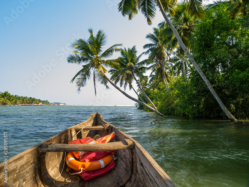 river cruise in the Kerala backwaters with traditional wooden fisherman boat photo