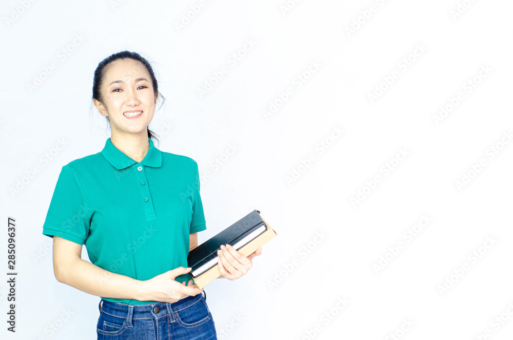 Asian women in a green shirt. she smiled and held several brown boxes at the same time isolated white background.Women send parcels. Asian women in a green shirt. she smiled and held several brown boxes at the same time isolated white background.Women send parcels.