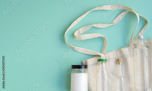 Top view cotton bag and bottles arrangement